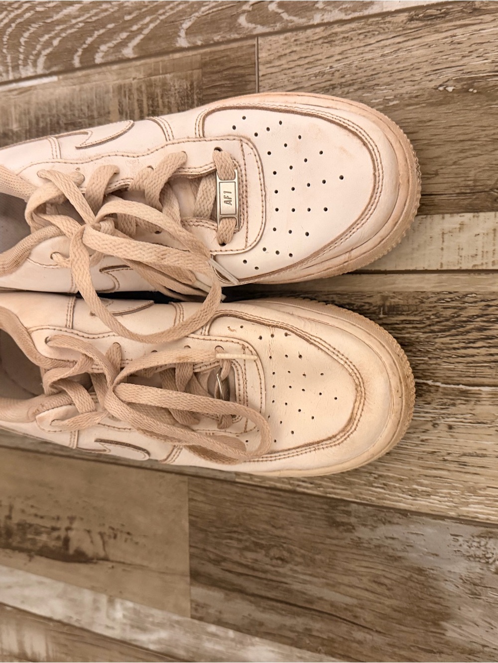 Nike Women’s Pale Blush Leather Sneakers